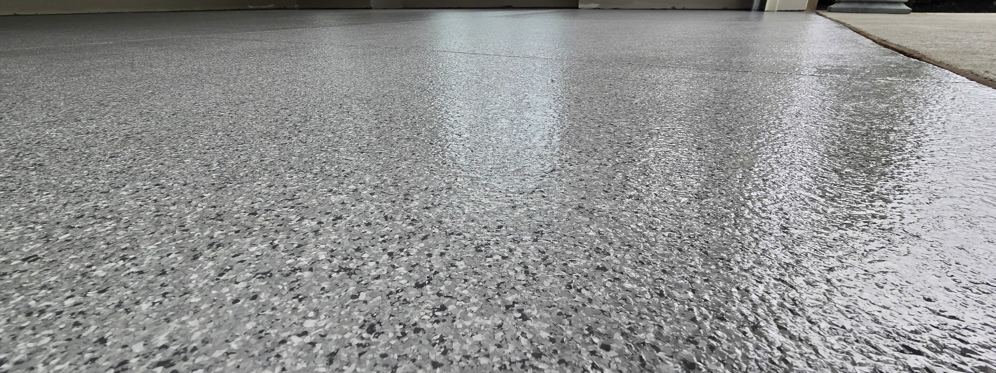 Close-up of an epoxy flake floor by All Out Coatings