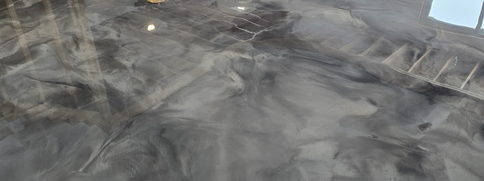 Marbled metallic epoxy floor by All Out Coatings